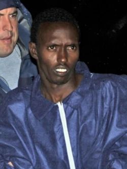 Federal agents
                        escort the Somali pirate suspect into FBI
                        headquarters at 26 Federal Plaza in New York on
                        April 20, 2009 by Leo Mitchell-Lammers (Source:
https://commons.wikimedia.org/wiki/File:Abdulwalimuse2_(cropped).jpg)