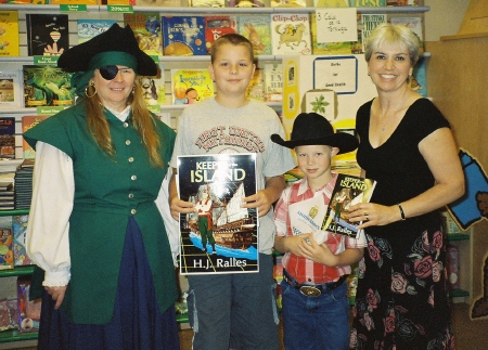 Cindy and
                Hilary pose with the winners