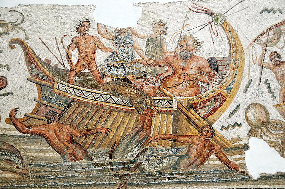 Roman mosaic showing Dionysus (panther)
                      scattering the pirates (dolphins) photo by Dennis
                      G. Jarvis, Source:
                      https://commons.wikimedia.org/w/index.php?curid=22832985)