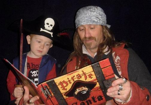 Jeff & Wilde MacKay reading
                                  Pirate Santa