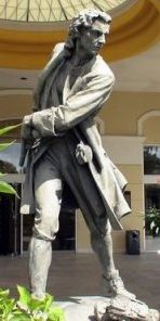 Statue of Woodes
              Rogers at Britich Colonial Hilton in Nassau. (Source:
              https://commons.wikimedia.org/wiki/File:WoodesRogersStatueNassau.jpg)
